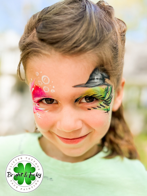 Smiling face with a custom face paint design: wicked eyes.